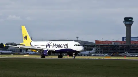 sbna Monarch plane on ground