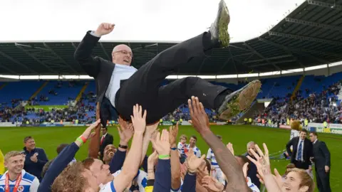 Jason Dawson Brian McDermott held aloft by Reading players after promotion in 2011/12