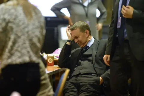 Anthony Devlin/Getty Images An official reacts as vote counters wait for ballot boxes to arrive at the Peter Paine Performance Centre for the constituency of Boston and Skegness