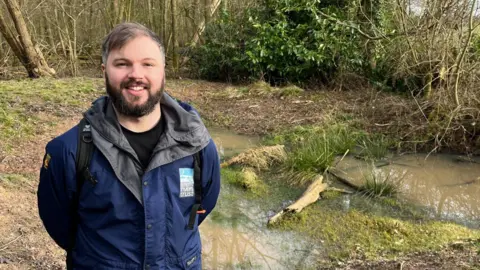 Nick Wilding, from the Trent Rivers Trust, stood near a part of the natural flood defences.