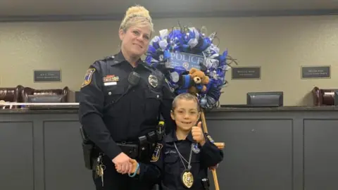 Freeport Police Department Abigail Arias with a Freeport Police Department officer
