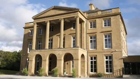 The Haining Charitable Trust The front of the Georgian Palladian villa Haining House with arches and pillars