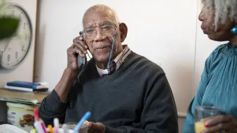 Getty Images An elderly man talking on the telephone