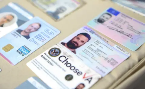 Getty Images ID cards of people linked to an operation denounced by Venezuelan President Nicolas Maduro are displayed during a meeting with members of the Armed Forces in Caracas, Venezuela on May 4, 2020