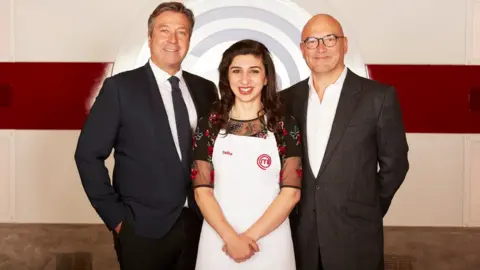 PA Media John Torode (left) and Gregg Wallace with Saliha Mahmood-Ahmed, MasterChef 2017 winner