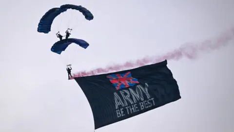 Finnbarr Webster / Getty Images The Tigers Army parachute display team