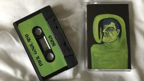 Tallulah Webb A green cassette tape