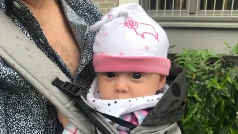 Ross Lowe Baby girl in a Derby County hat