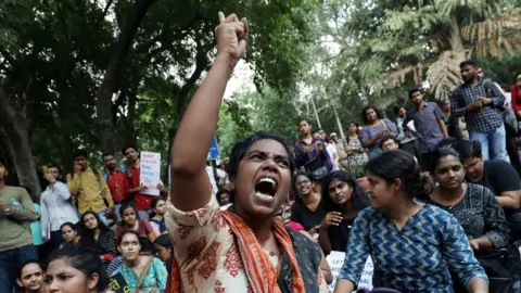 Reuters A student shouts slogans during a protest against the scrapping of the special constitutional status for Kashmir by the government, in Delhi, India, August 8, 2019