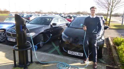 BBC Matthew Thomason with his electric car