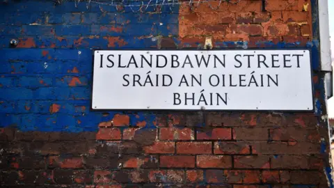 Getty/ Charles McQuillan Street sign in English and Irish