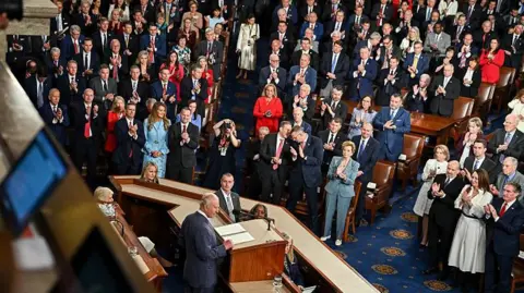 Getty Images King Charles speaks to a crowded chamber in Congress, many of the politicians can be seen on their feet as the monarch spoke.