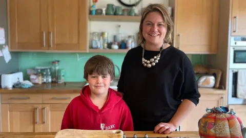 BBC Jayne Saywell and her son Peter have suffered in the latest outbreak of whooping cough