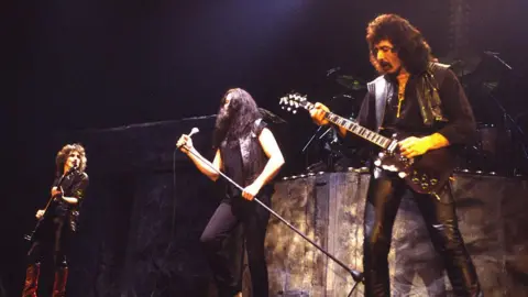 Getty Images Geezer Butler, Ian Gillan and Tony Iommi of Black Sabbath pictured on stage in 1984