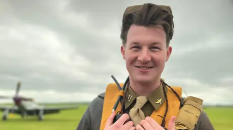 Emma Baugh/BBC  Jack McCombie dressed as a World War Two US airman at Duxford 