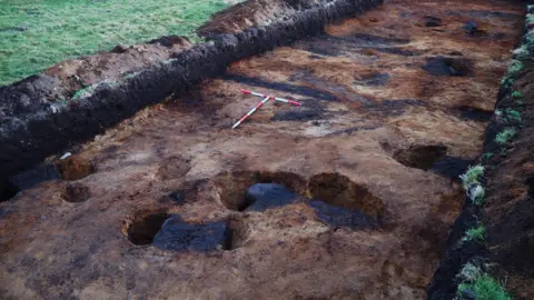Scottish Water An Iron Age roundhouse during excavation.