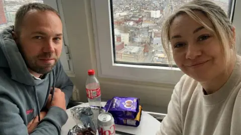 Charlie MacGillivray Charlie MacGillivray right) has long blonde hair and a light sweater. Richard Stevens has short brown hair and a brown beard and wers a blue-grey hoodie