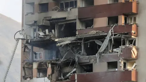 An apartment block partially destroyed by explosions 
