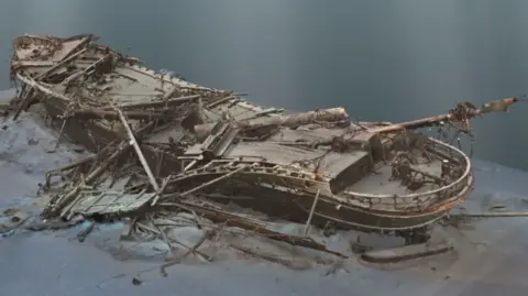 Falklands Maritime Heritage Trust A CGI of the Endurance shipwreck. A long thin wooden boat at the bottom of the sea, seemingly flattened or crushed.