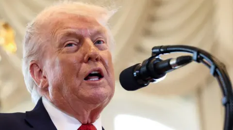 US President Donald Trump speaks at a ceremony held to dedicate a 4-mile stretch of road from West Palm Beach Airport to his Mar-a-Lago estate as 'President Donald J. Trump Boulevard', at the Mar-a-Lago estate in Palm Beach, Florida, U.S., January 16, 2026. 