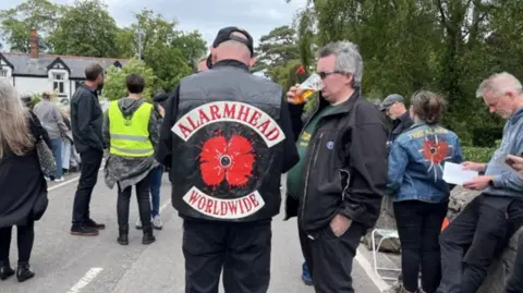 Alarm fan at Mike Peters funeral