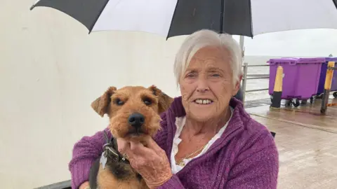 Jo Burn/BBC Jacqueline Bowler and her dog Jake