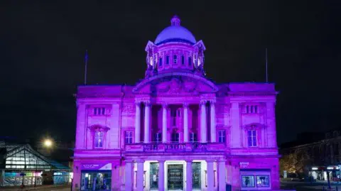 Hull City Council Hull City Hall lit up in purple at night