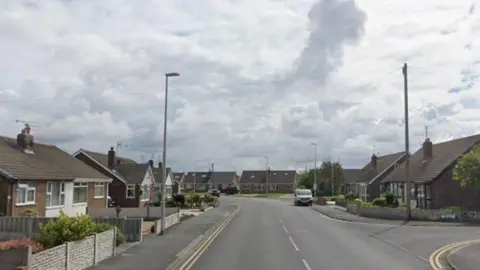 A suburban street of bungalows.