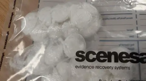 Cambs Police A clear plastic police evidence bag contains white drugs wrapped in plastic