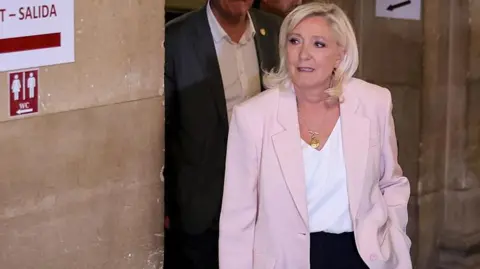 President of far-right party Rassemblement National (RN) parliamentary group Marine Le Pen arrives to attend the verdict in the appeal trial of RN former or actual members on charges of embezzlement 