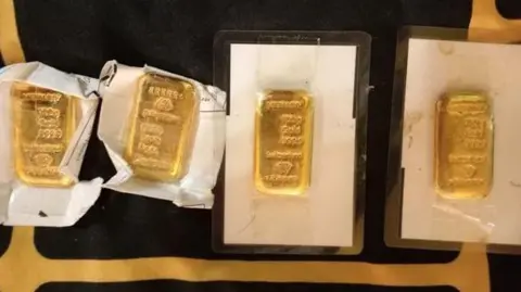 Four gold bars, believed to have been stolen during a burglary in Hatherleigh, Devon  