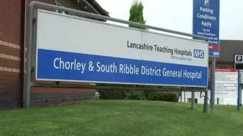 A sign says Chorley and South Ribble District General Hospital and Lancashire Teaching Hospitals NHS Foundation Trust.