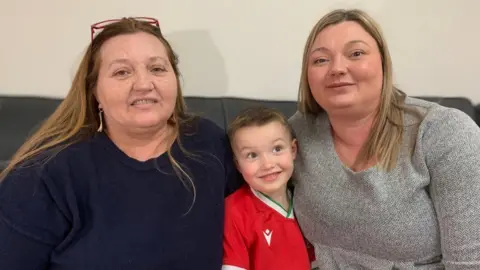 Vicki sat with her 5 year old son Gethin and mum, Mandy