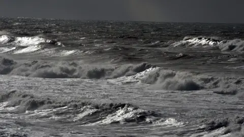 Getty Images A stock image of heavy waves are seen off Lacanau's beach in south-western France