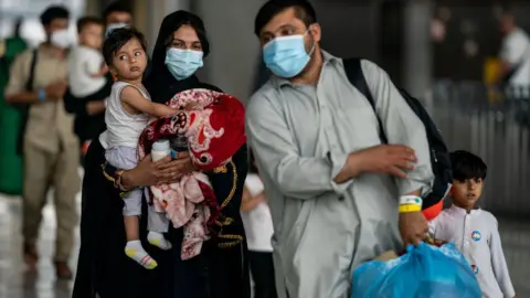 Getty Images Afghan migrants arrive in Virginia last month