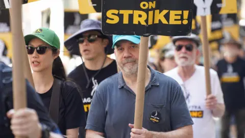 Getty Images Paul Giamatti joins SAG-AFTRA members as they maintain picket lines across New York City during strike on July 31, 2023 in New York City