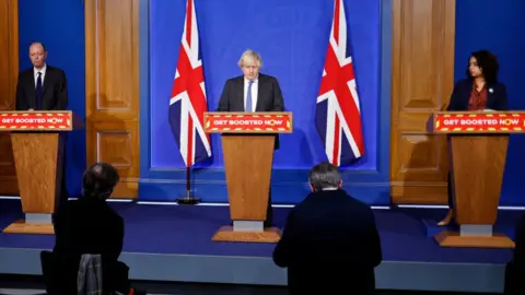 Getty Images Prime Minister, Boris Johnson (C), England's chief medical officer Prof Chris Whitty (L) and Medical Director of Primary Care for NHS England and NHS Improvement, Dr Nikki Kanani