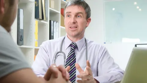 Getty Images GP talking to a patient