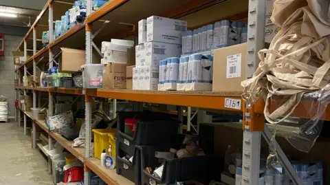 Shelves of hygiene products in a warehouse