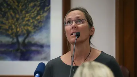 Reuters Scarlett Lewis, mother of 6-year-old Sandy Hook shooting victim Jesse Lewis, testifies against Alex Jones for the trial against Alex Jones, in Austin, U.S. Aug 2, 2022.