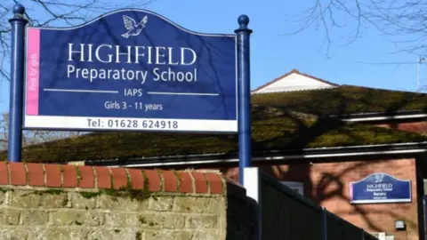 Highfield Prep School - sign outside school building.