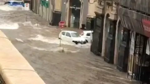 A flooded street in Catania's city centre