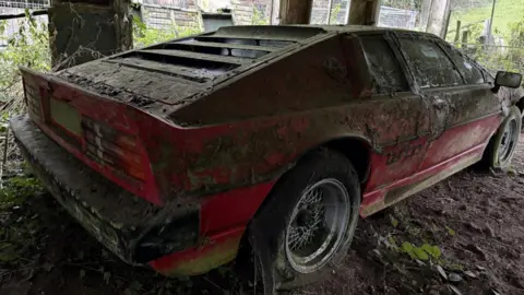 Charterhouse A rear and side shot of the car in the barn.