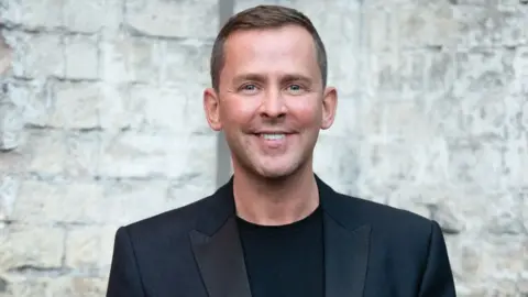 Getty Images Scott Mills attends the Sun's Who Cares Wins Awards 2021 at The Roundhouse on September 14, 2021 in London, England