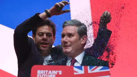 Man throws glitter over Sir Keir Starmer