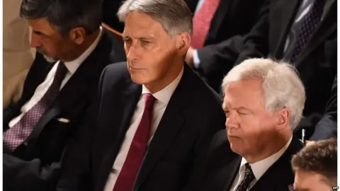 AFP Philip Hammond and David Davis listening to the speech