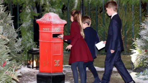 PA Media Princess Charlotte, Prince Louis and Prince George post letters ahead of the Royal Carols - Together At Christmas service at Westminster