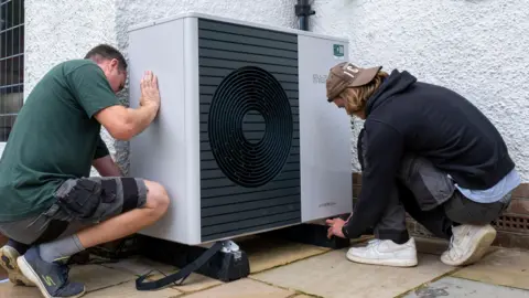 Getty Images Heat pump installation