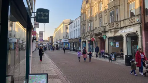 BBC People walking up and down Westgate in Ipswich in winter