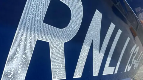 Andrew Turner/BBC Names appear within the text RNLI 13-44